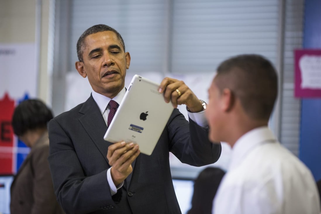 US President Barack Obama uses an Apple iPad tablet computer to record a seventh grader in Maryland in February. Photo: EPA