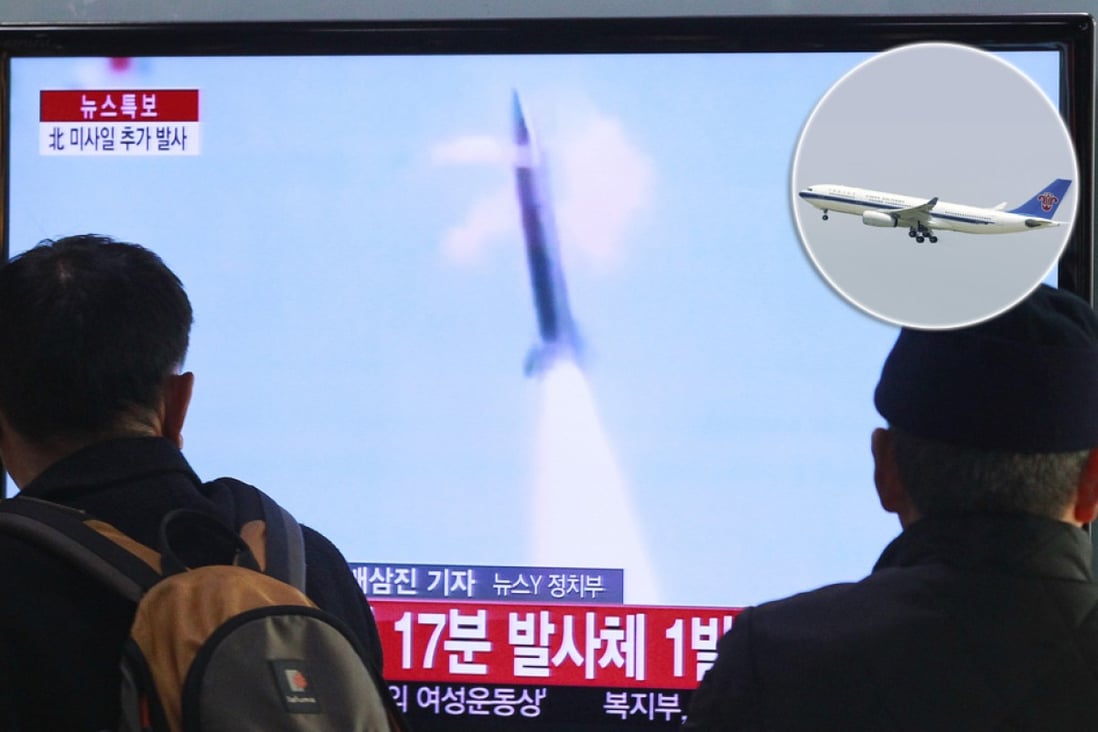 A China Southern Airlines airplane carrying 220 passengers passed through the trajectory of a North Korean rocket (seen on the news in Seoul above). Photos: AP, Reuters