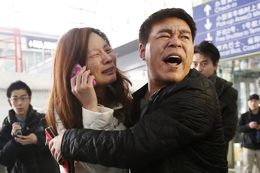 People believed to be passengers' relatives waiting at Beijing airport on Saturday morning. Photo: Reuters