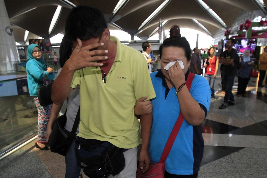 Relatives of the passengers onboard wait anxiously for news at the airports in Kuala Lumpur and Beijings. Photo: AP