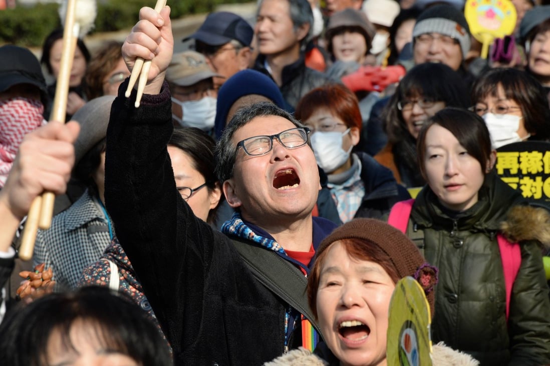 People shout slogans as they march during an anti-nuclear power plant demonstration in Tokyo. Photo: AFP
