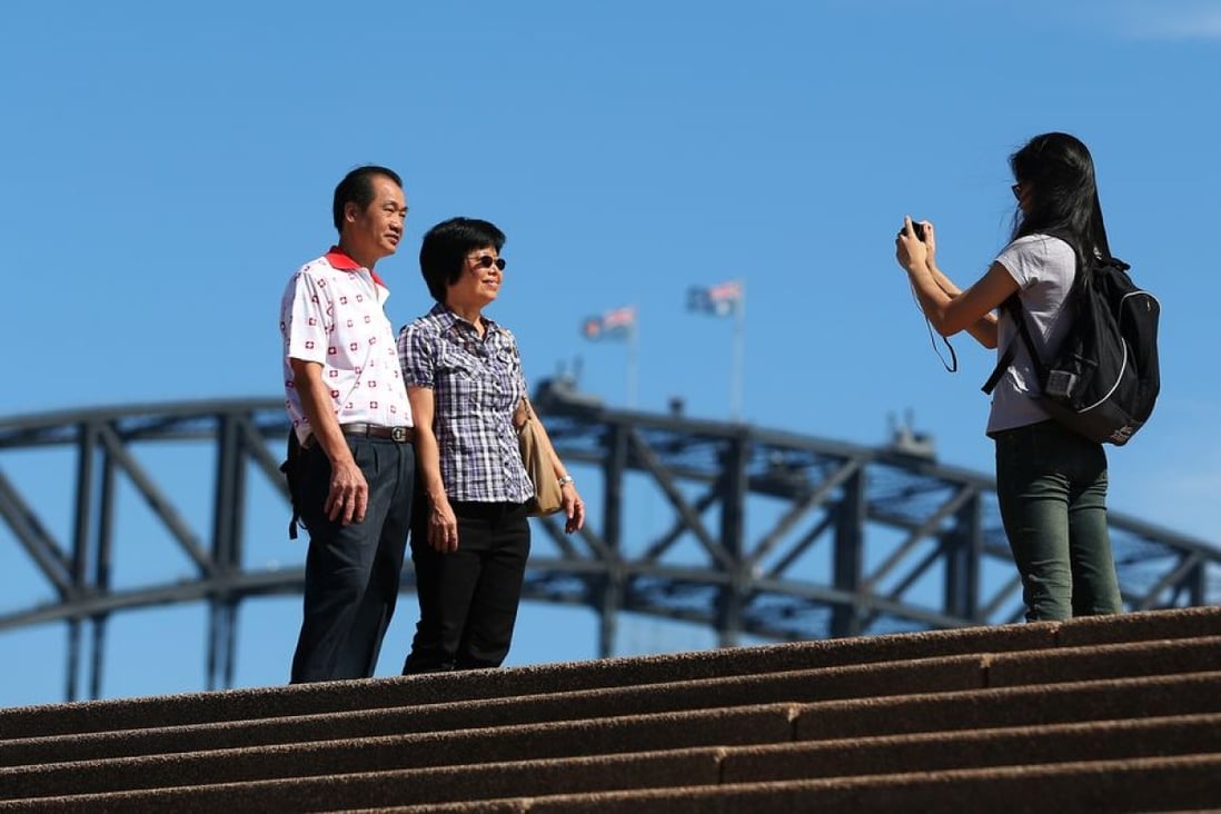 Putonghua-speaking guides take tourists up the Sydney Harbour Bridge. Photo: Bloomberg