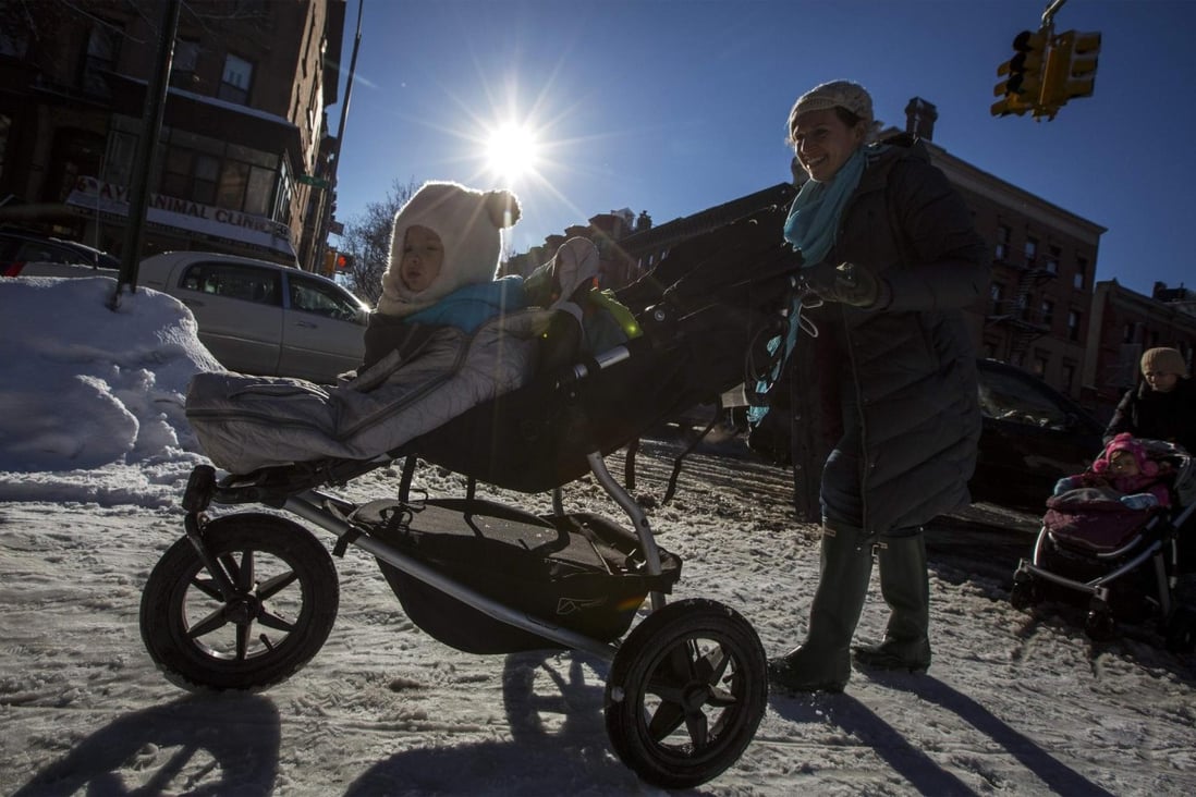 Women push prams in middle-class Park Slope, Brooklyn, an area that highlights inequities in the property tax system. Photo: Reuters