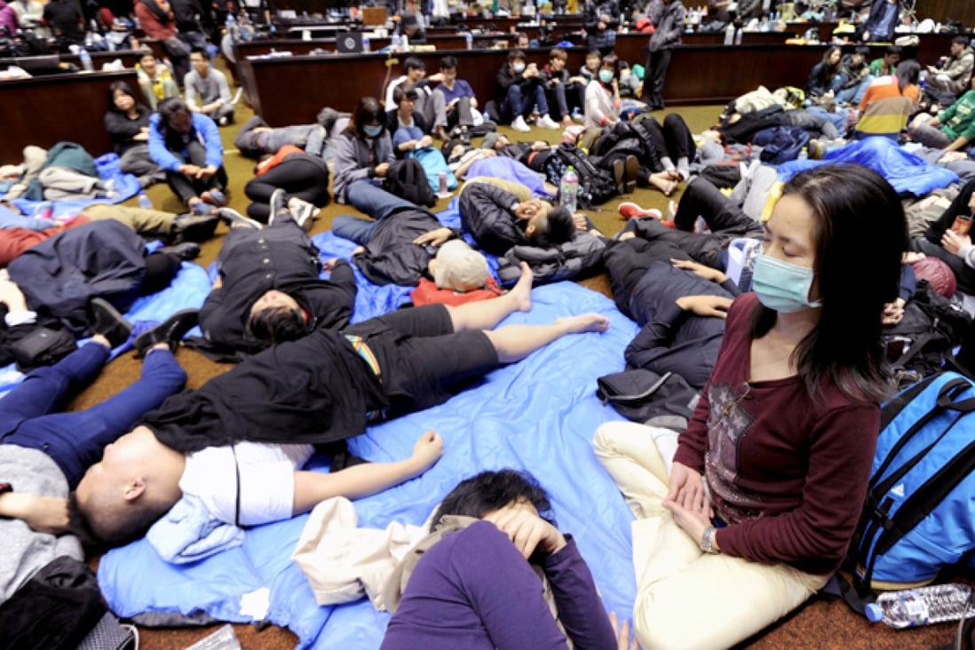 Students continue to occupy Taiwan's legislature yesterday, but fear involvement by the opposition could dilute their message. Photo: AFP