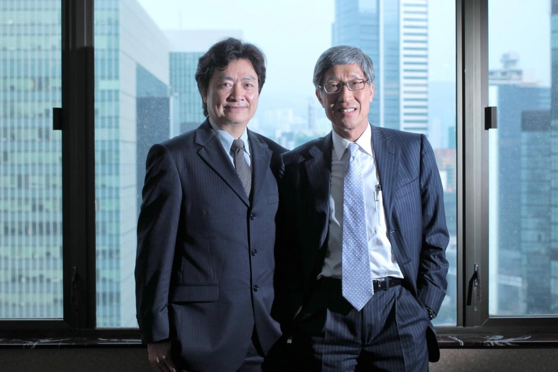 The comeback of Joseph Ling (left) and Billy Fung sparks speculation that a takeover battle for Midland may unfold. Photo: Thomas Yau