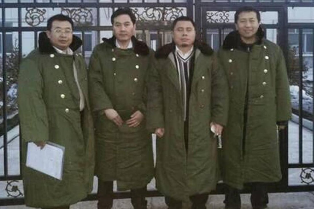 Zhang Junjie (second left) with the three lawyers who are still being held. Photo: SCMP