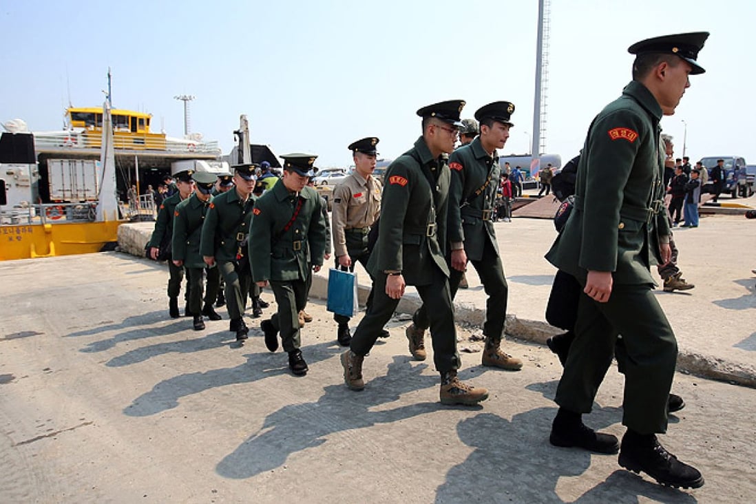 South Korean marines arrive on Baengnyeong, the island where the unmanned drone crashed, on Tuesday. Photo: Reuters