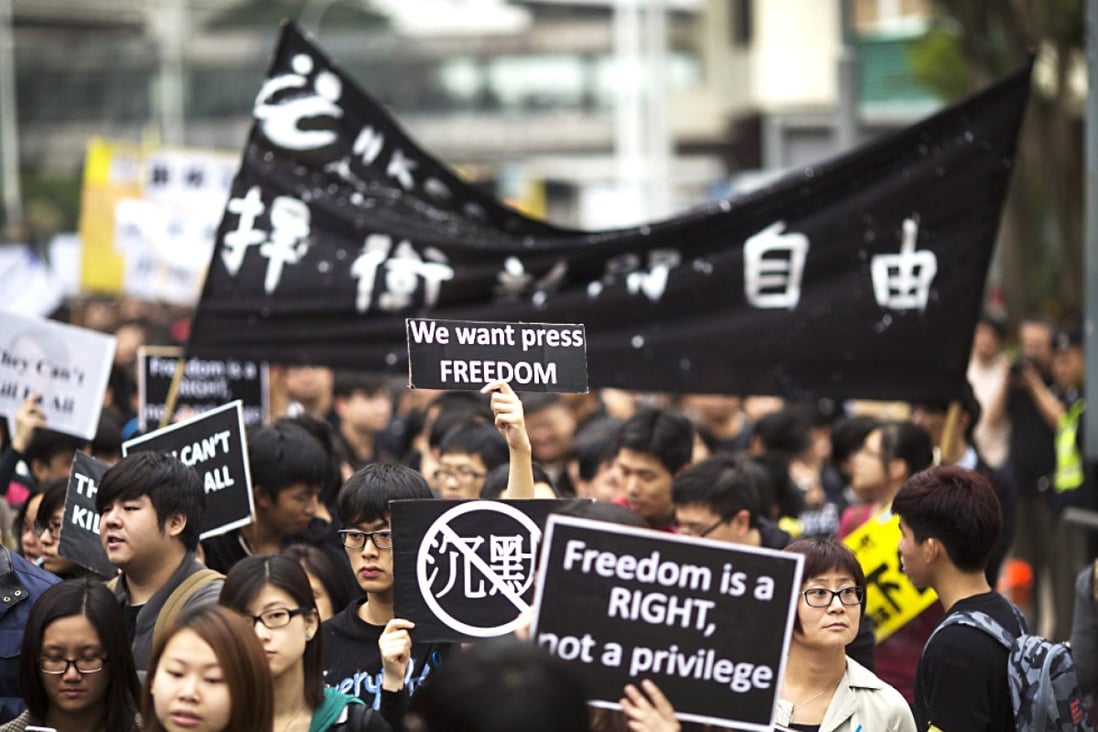 Journalists take to the streets to to urge chief executive to protect their independence. Photo: SCMP