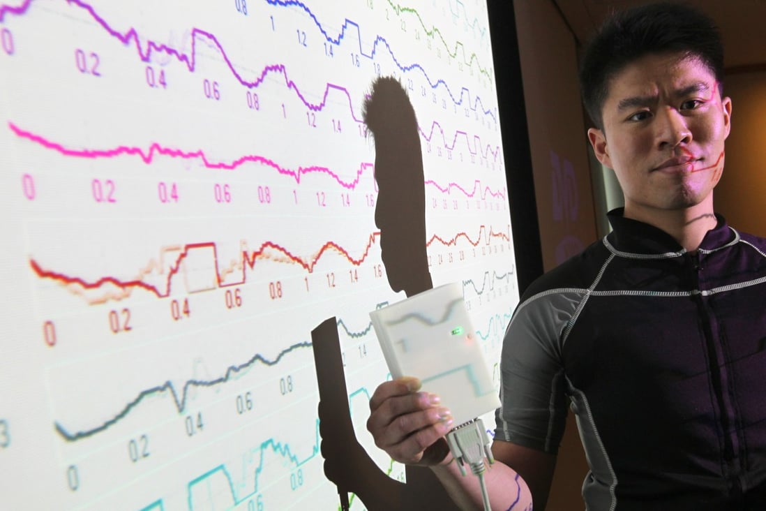Steve Chim, a member of the City University research team shows off the ECG monitoring jacket. Photo: Dickson Lee
