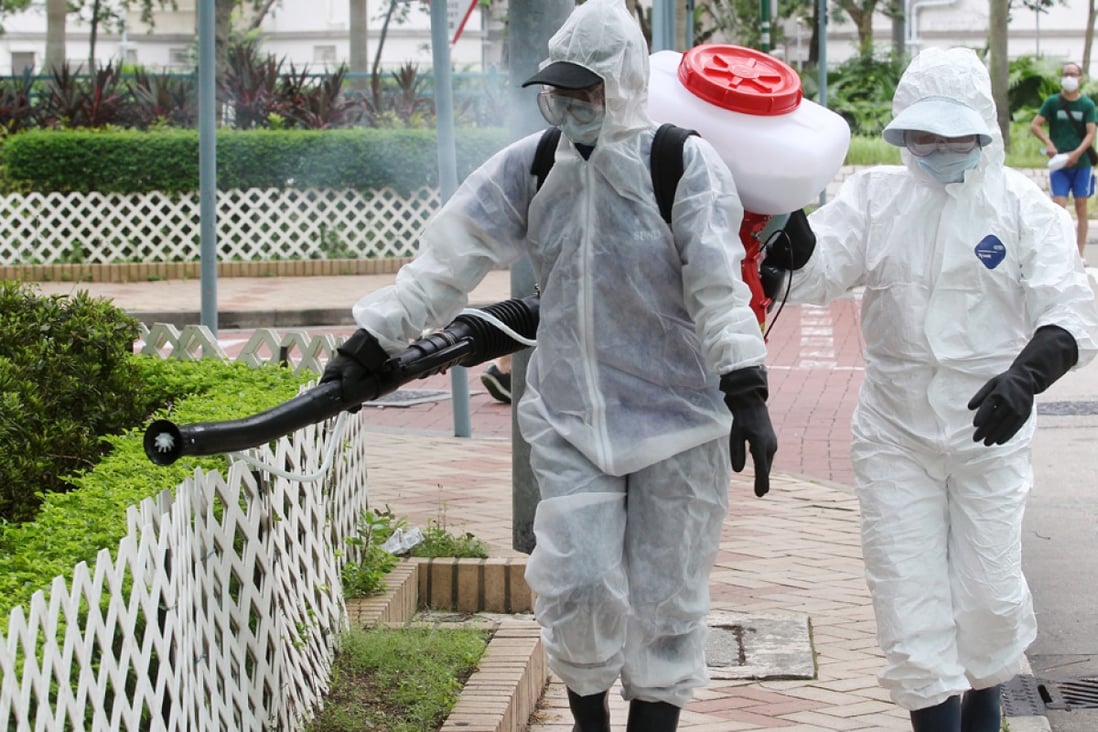 Staffs from Food and Environmental Hygiene Department use aerosol to kill mosquitos in the area around Tin Hang Estate in Tin Shui Wai, after a man was diagnosed to have been infected with Japanese Encephalitis. Photo: K. Y. Cheng