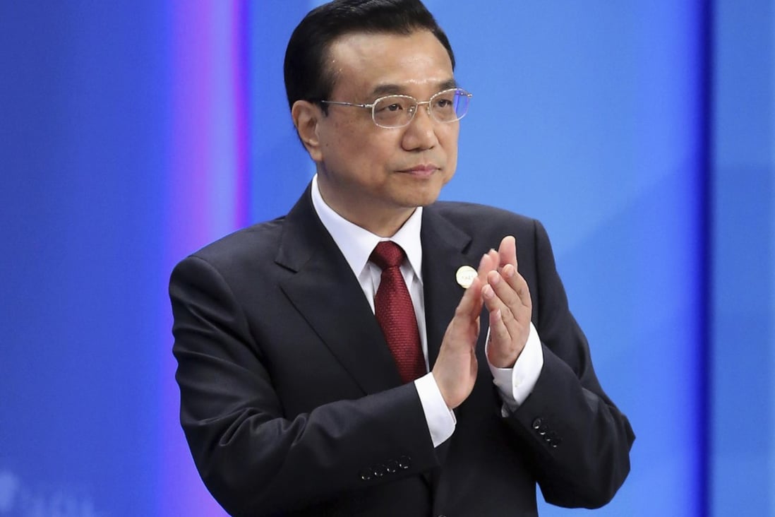 Chinese Premier Li Keqiang claps as he attends the opening ceremony of the Boao Forum for Asia Annual Conference 2014 in Boao, Hainan province April 10, 2014. Photo: Reuters 