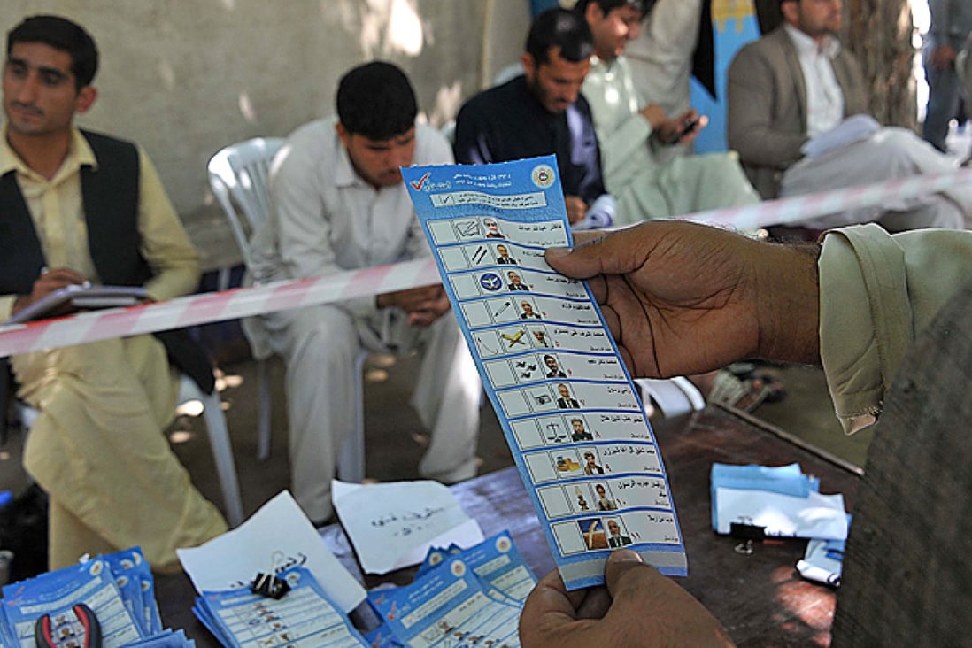 Afghan election workers count ballots at an Independent Election Commission office in Jalalabad on April 16. Photo: AFP
