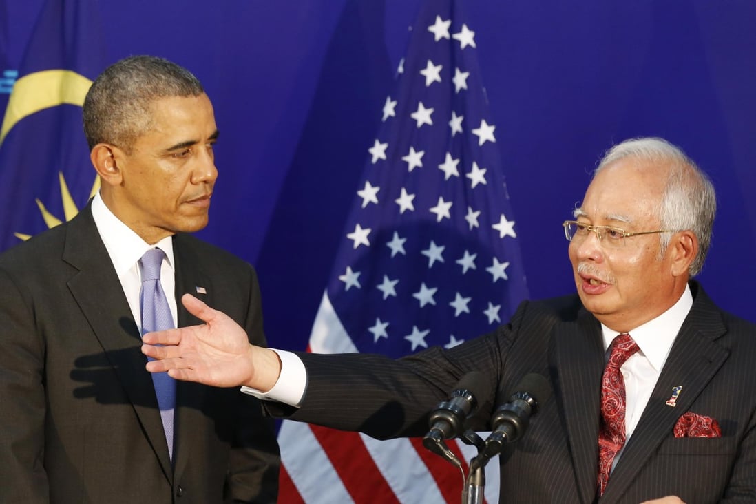 Barack Obama and Najib Razak yesterday.