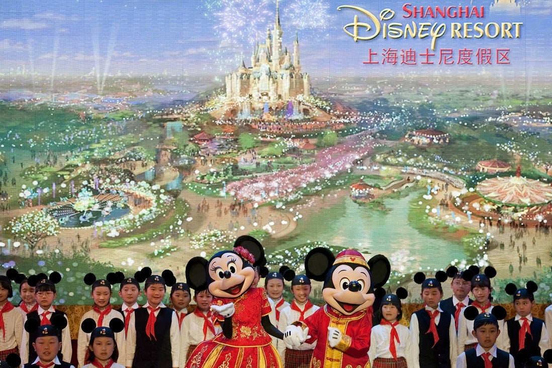 Performers dressed as Disney characters dance on stage during a groundbreaking ceremony of the world's sixth Disney amusement park in Shanghai. Photo: AP