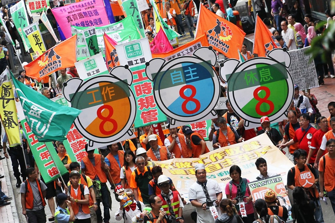Employees march to demand an eight-hour working day. Photo: Felix Wong