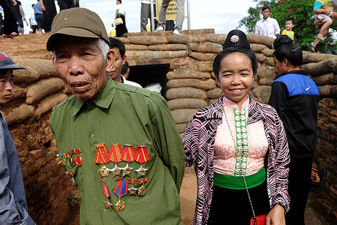 Vietnamese Dien Bien Phu veteran Quang Van Song, 82, walks in a former trench of French troops on Eliane 2 hill in the northwestern town of Dien Bien Phu. Photo: AFP