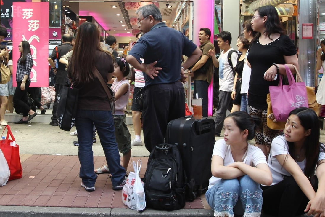 Shoppers outside a cosmetics store in Mong Kok. Photo: Felix Wong