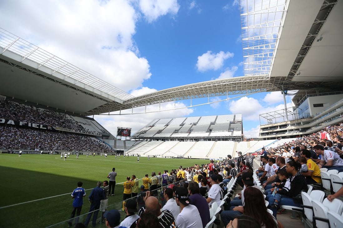 People attend a test event for the opening game of FIFA World Cup Brazil 2014, at Arena de Sao Paulo stadium. Photo: Xinhua