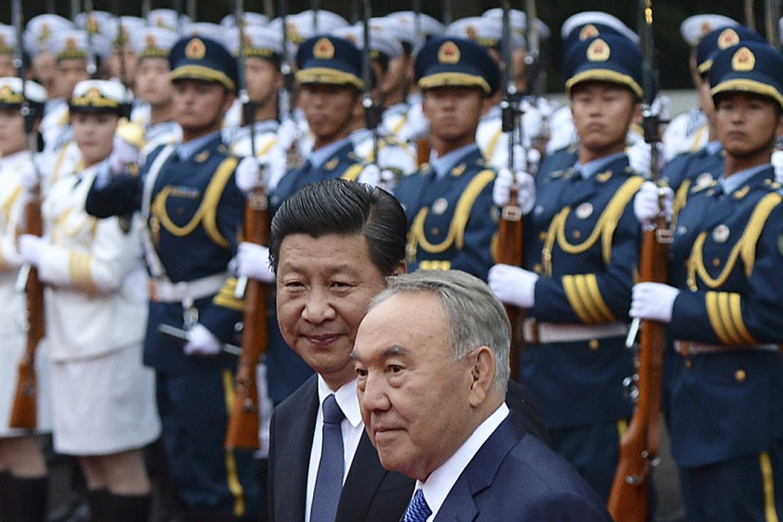 China's President Xi Jinping (left) and Kazakhstan's President Nursultan Nazarbayev look on next to an honour guard during a welcoming ceremony at the eve of the fourth Conference on Interaction and Confidence Building Measures in Asia (CICA) summit, in Shanghai. Photo: Reuters