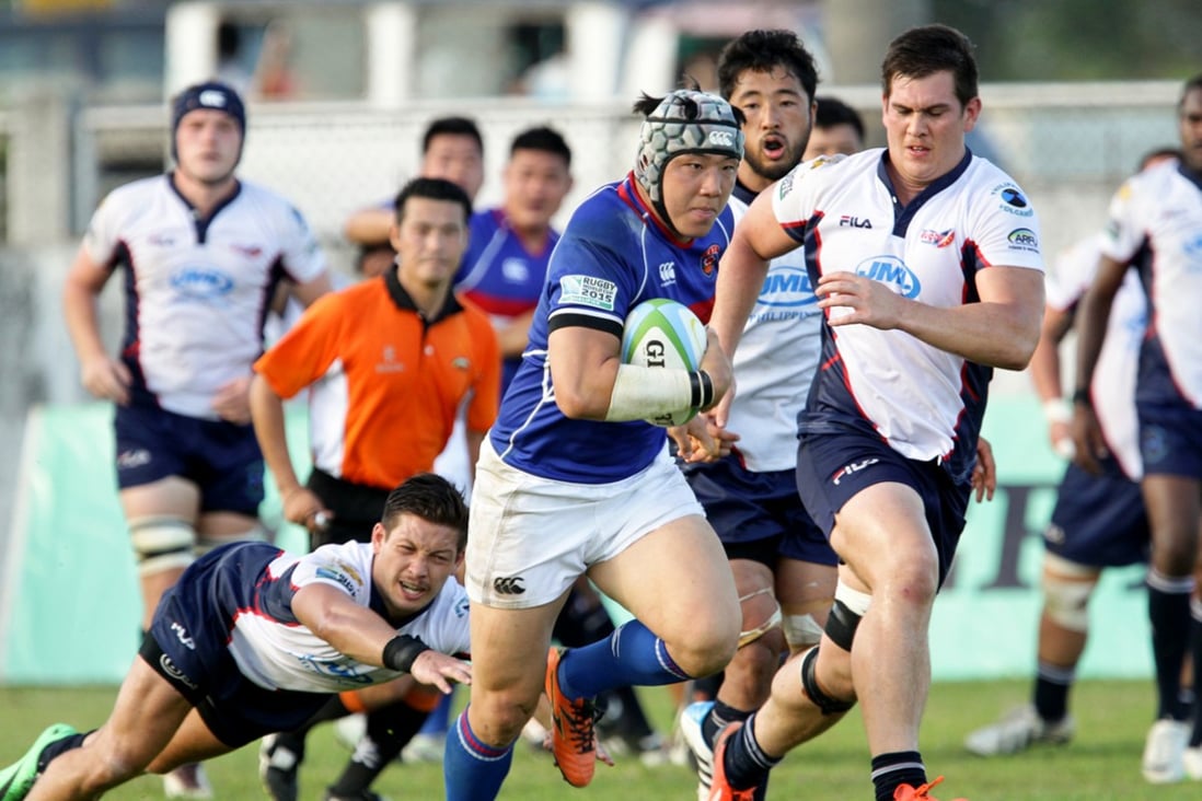 South Korean centre Kim Nam-uk gives Philippines winger Kenneth Stern the slip during their A5N encounter in Laguna on Saturday. Photos: ARFU