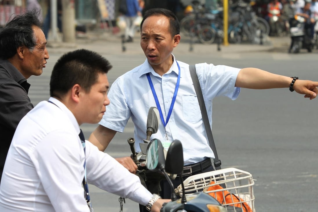 Wang Tao on patrol at traffic lights in Beijing. Photo: Simon Song