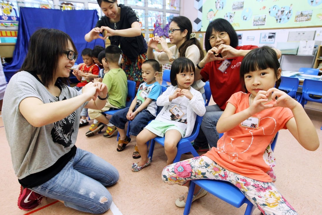 Parents and children learn sign language at Peace Evangelical Centre Kindergarten in Ngau Tau Kok. Photos: Edward Wong