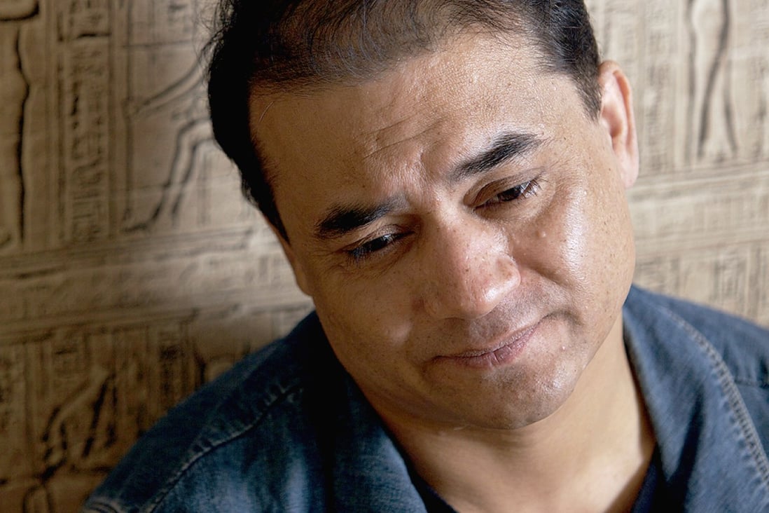 Ilham Tohti was jailed in January for allegedly recruiting students to join separatist movements. Photo: Ricky Wong