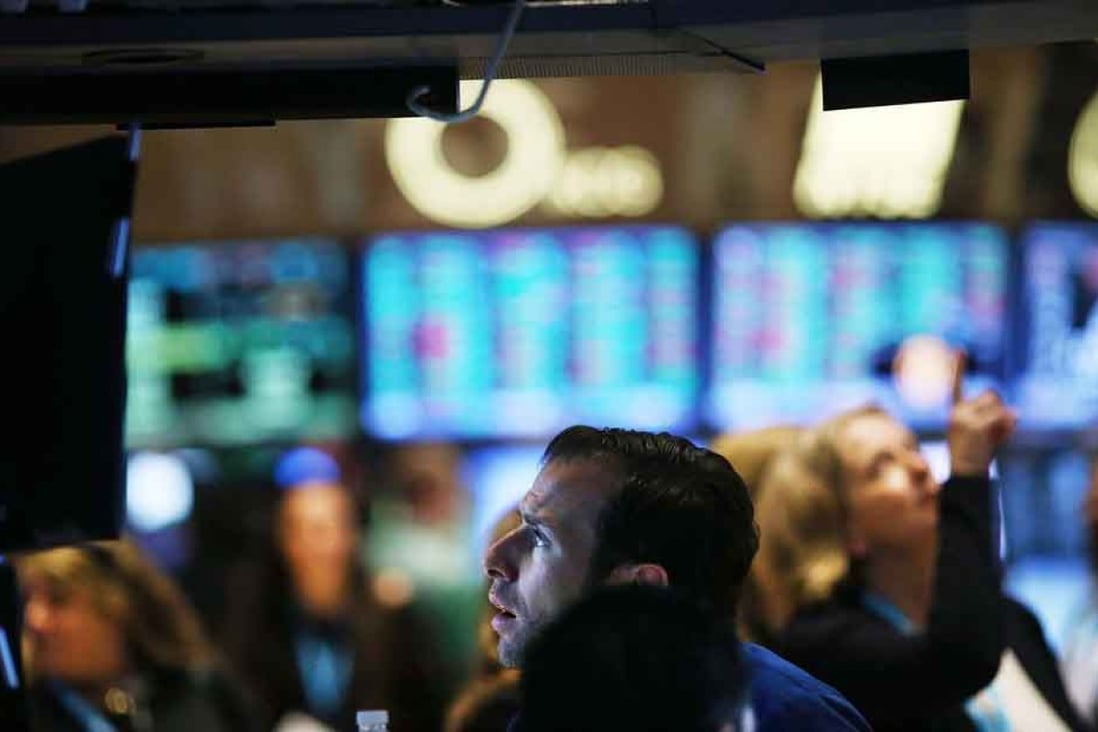 A trader works on the floor of the New York Stock Exchange. Photo: AFP