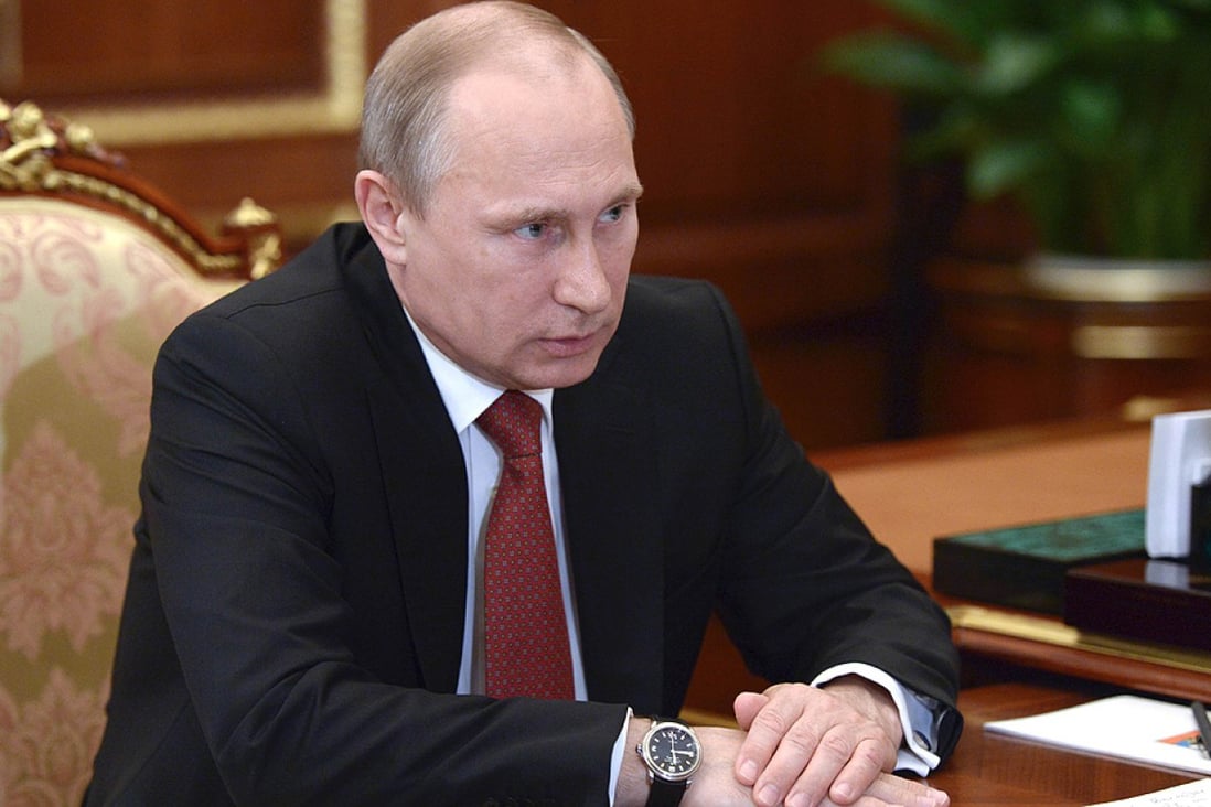 Russia's President Vladimir Putin attends a meeting at the Kremlin in Moscow on Friday. Photo: AFP