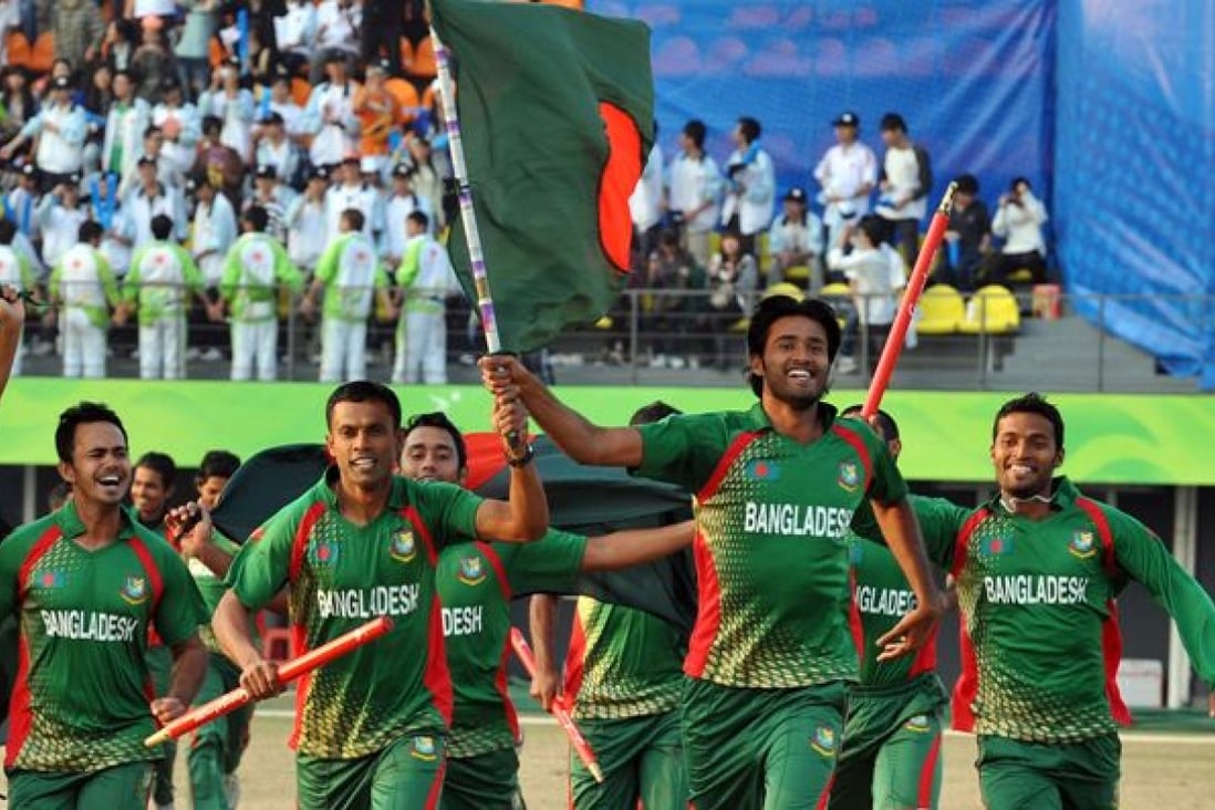 Bangladesh players invade the ground to celebrate victory over Afghanistan in the final cricket match at the 16th Asian Games in Guangzhou in 2010. Photo: AFP