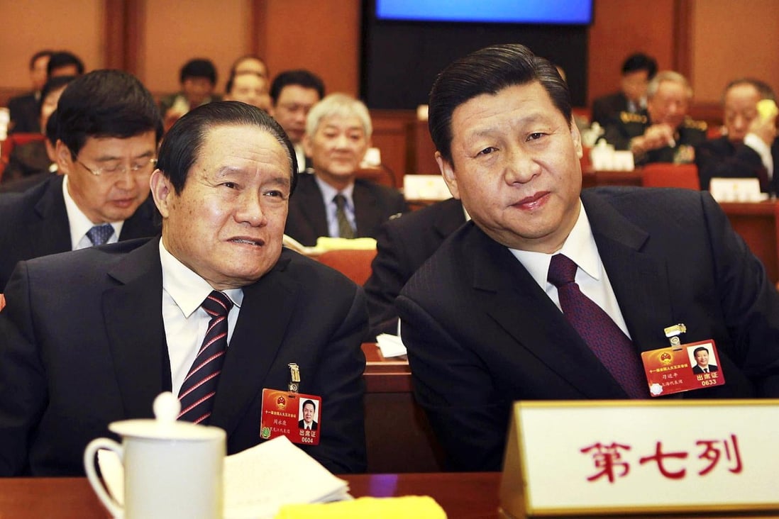 Zhou Yongkang (left) sits with Xi Jinping at the National People's Congress in 2012. Photo: CNS