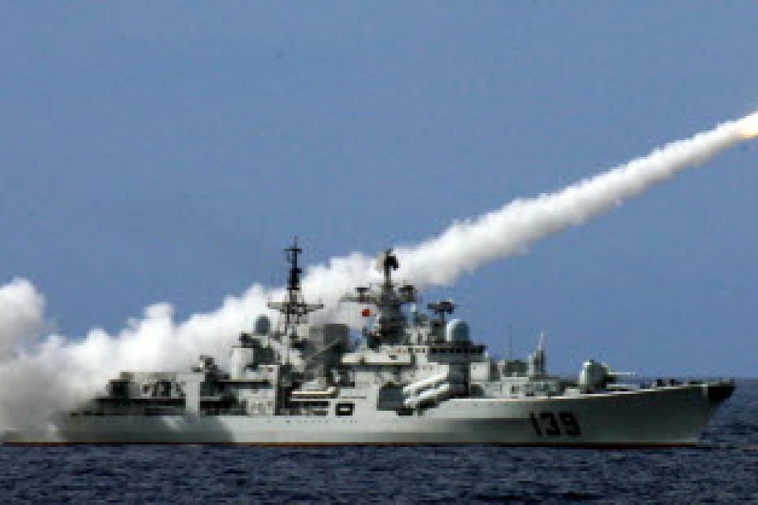 A Chinese warship fires a missile during a live ammunition drill in the South China Sea. Photo: Xinhua 