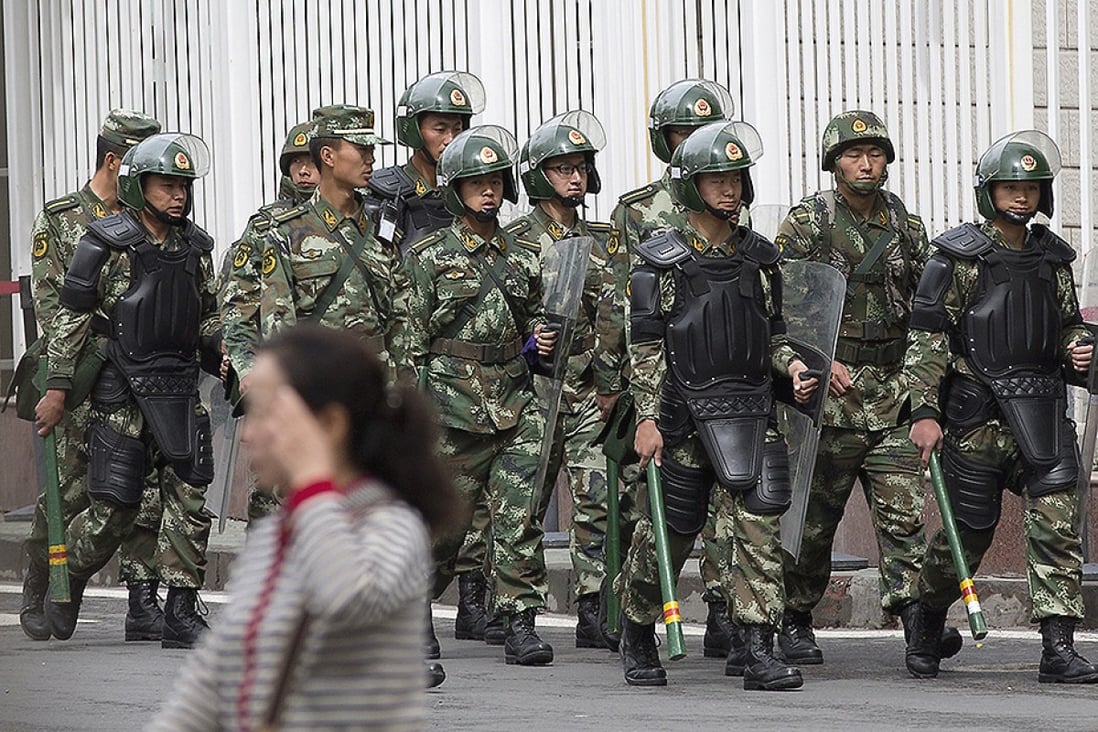 Police patrol in Urumqi, capital city of Xinjiang Uyghur Autonomous Region, in the wake of a series of terror attacks. Photo: AP