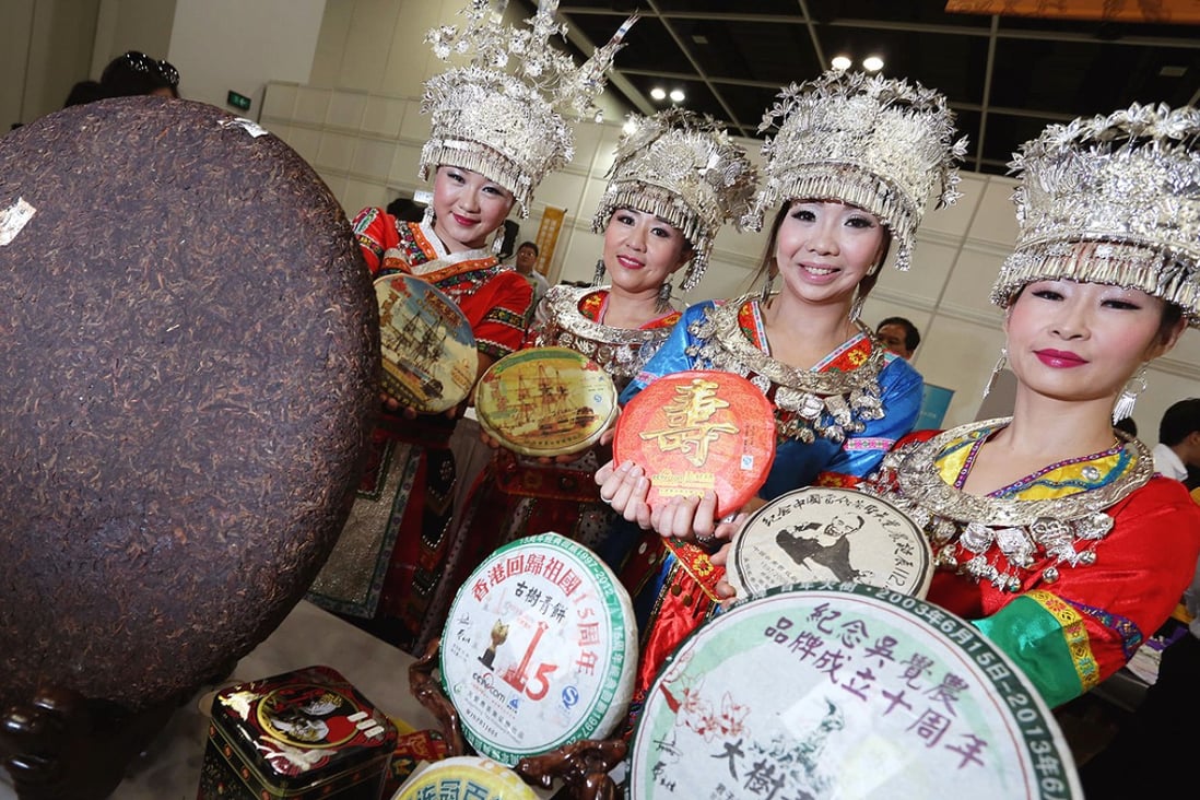 Wujuenong Tea staff in traditional costumes prepare for next week's International Tea Fair – part of the five-day Food Expo. Photo: Nora Tam