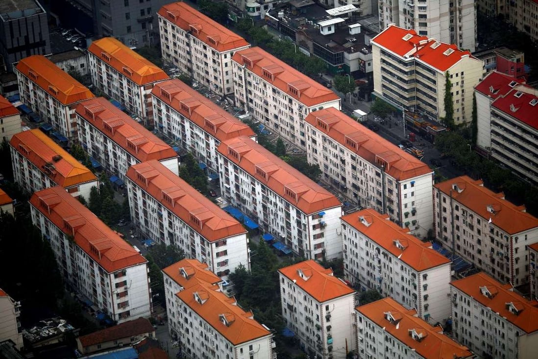 Residential buildings in Shanghai. 13 major property agencies in Shanghai have terminated their listings on SouFun's website. Photo: Reuters
