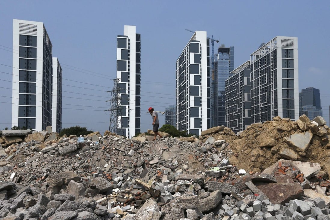 Construction site in front of newly built residential buildings in Yongkang, Zhejiang province. Local governments have urged China’s state-owned enterprises to prop up the market, driving land prices to record highs. Photo: Reuters