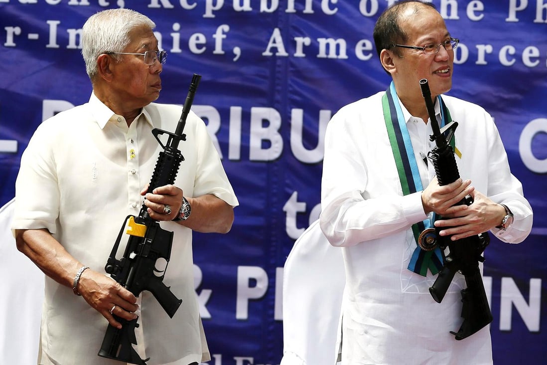 Philippine President Benigno Aquino (right), seen here with the defence secretary, may try to amend the constitution. Photo: EPA