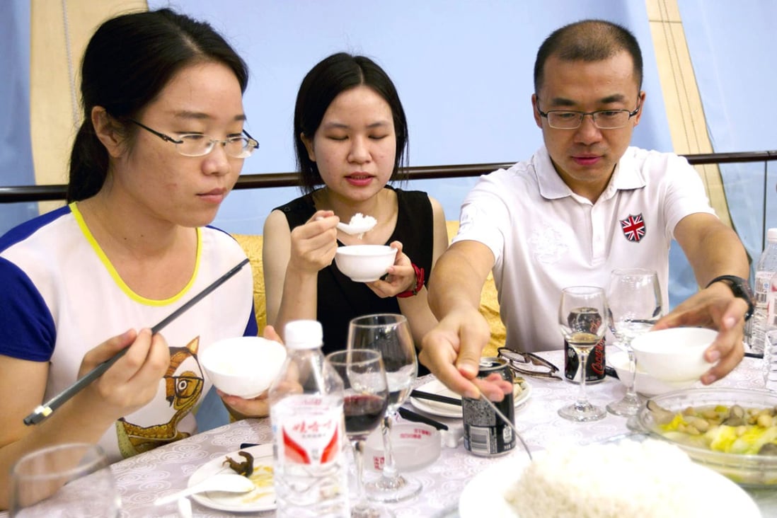 Diners try out GM rice at a tasting event in Beijing. Photo: Simon Song