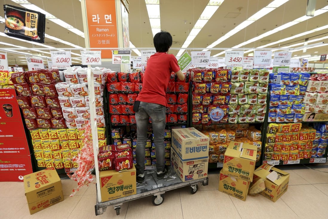 A employee stocks instant noodles at a Seoul store. South Koreans eat more instant noodles per capita than anyone in the world. Photo: AP