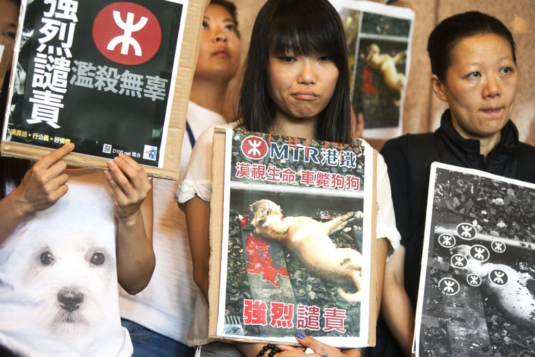 A group of protesters criticise the MTR for its lack of concern for life. Photo: EPA