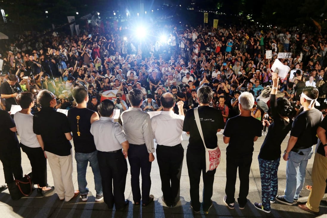 Occupy Central supporters rally outside government headquarters in Admiralty last night. They have vowed to push on with their campaign. Photo: Felix Wong