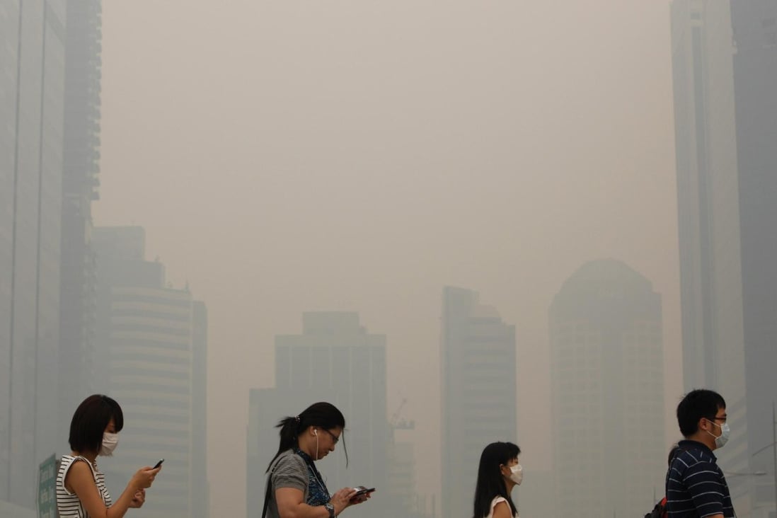 Polluted air in Singapore will affect these people. Photo: Reuters