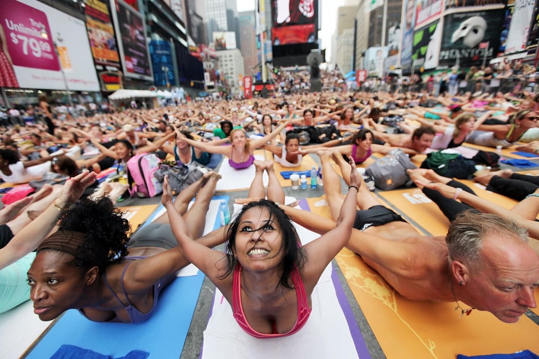 Summer Solstice Yoga in New York's Times Square inspired the OmTogether event. Photo: AFP