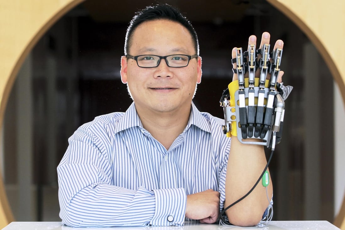 Michael Tsui of Rehab-Robotics with the Hand of Hope. Photo: Bruce Yan
