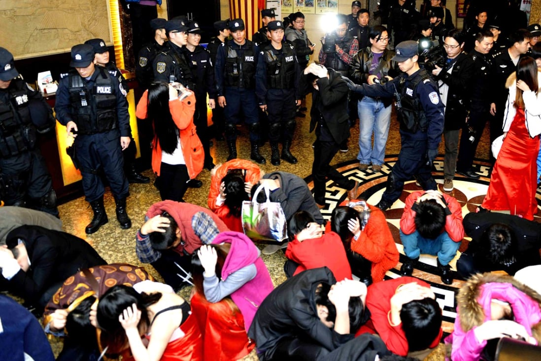 Suspects detained during a raid in February, which was part of a crackdown on prostitution in Dongguan that involved about 6,500 police. Photo: Reuters