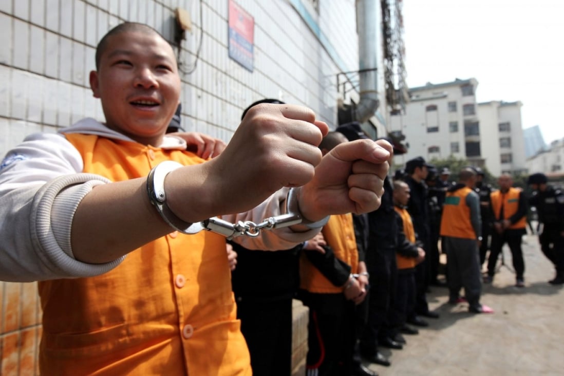 Gangsters arrested on economic crimes are paraded by Chinese police. Photo: AFP