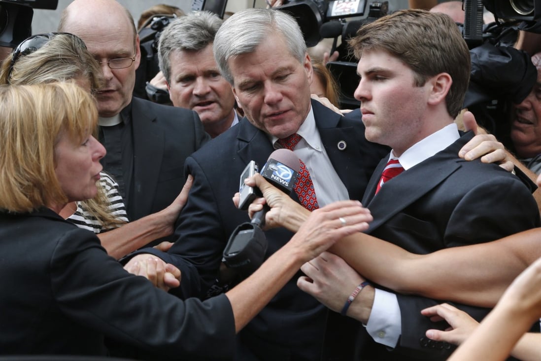 Former Virginia governor Bob McDonnell (centre) was mobbed by the media outside the courthouse in Richmond, after he and his wife were convicted on multiple counts of corruption. Photo: AP