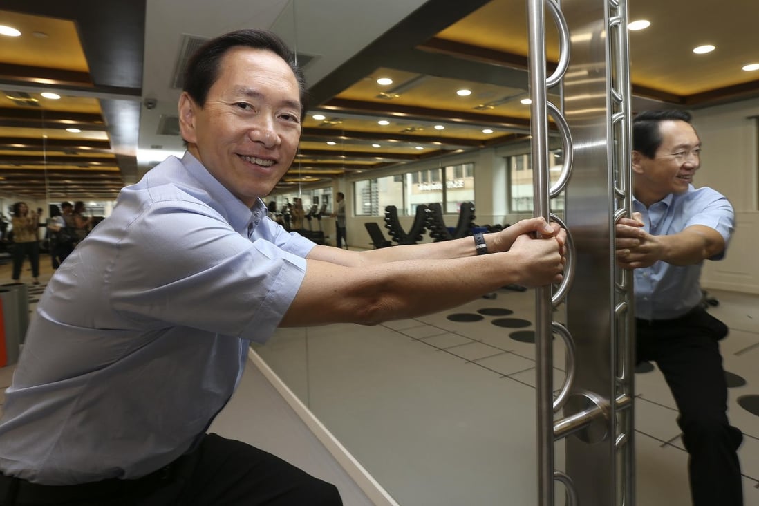 Businessman and politician Bernard Chan works out at his exercise facility that is aimed at helping the elderly keep fit and remain engaged with the community. Photo: K. Y. Cheng