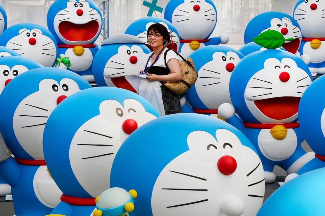 Life-size figures of Doraemon on the roof of the Tokyo Tower Foot Town on July 18, 2013. Photo: AFP