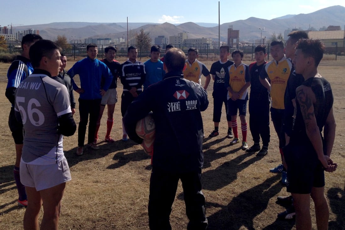 Hong Kong’s new national coach development manager Peter Drewett talks tactics with the Mongolia national 15s side at their Ulan Bator training ground. Photos: Andy Hall